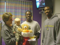 Jay Philippe & Jeremy Anderson with a young patient and his mother